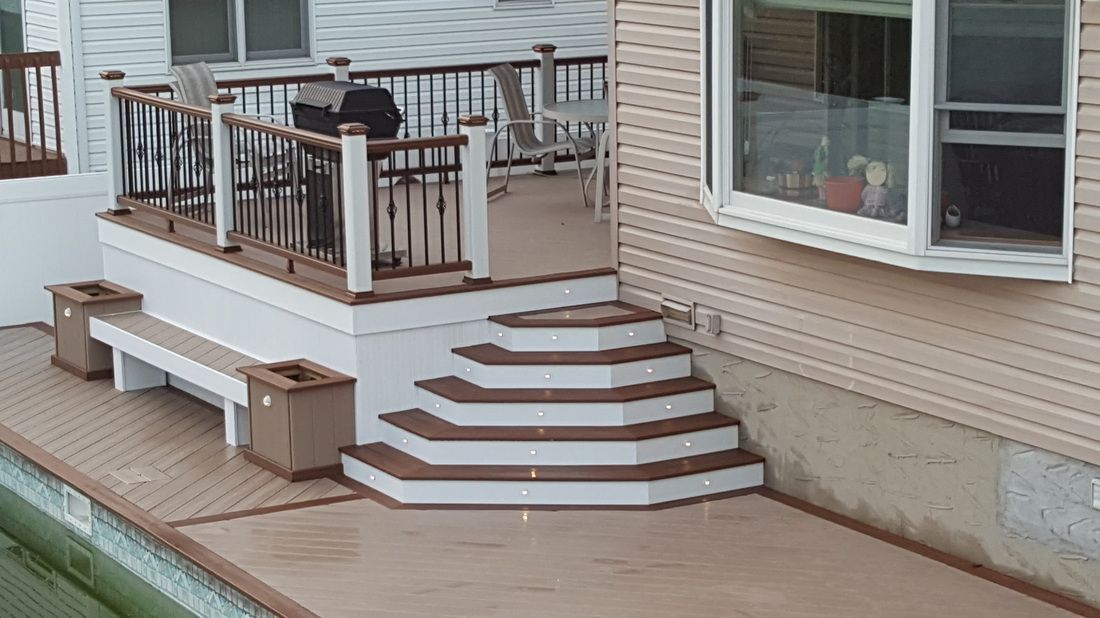 Composite deck with cascading hexagonal stairs and lit risers