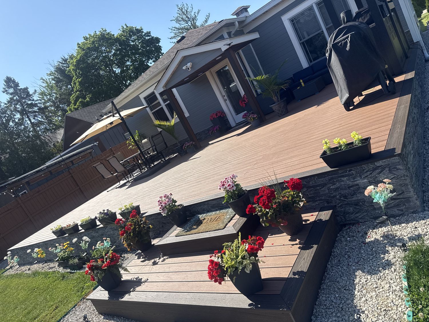 Composite deck with integrated planter boxes and flowers