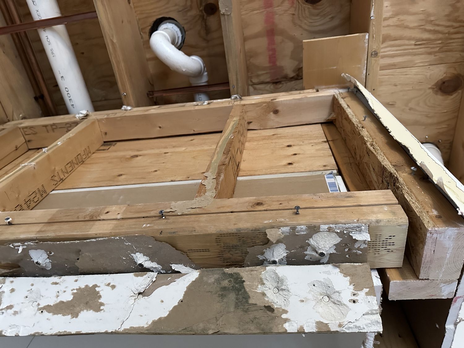 Ceiling opened to replace water damaged joists and plumbing