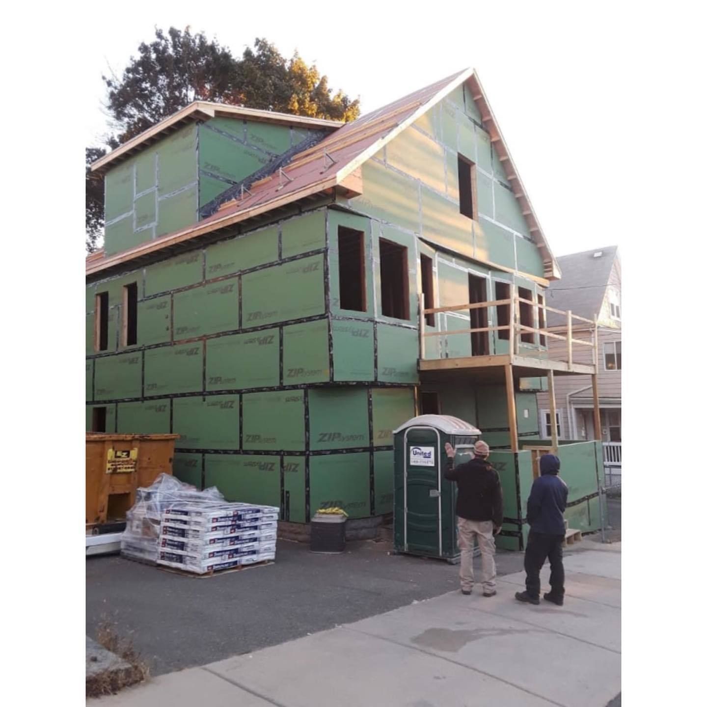 Full second storey addition framed and sheathed with weather barrier