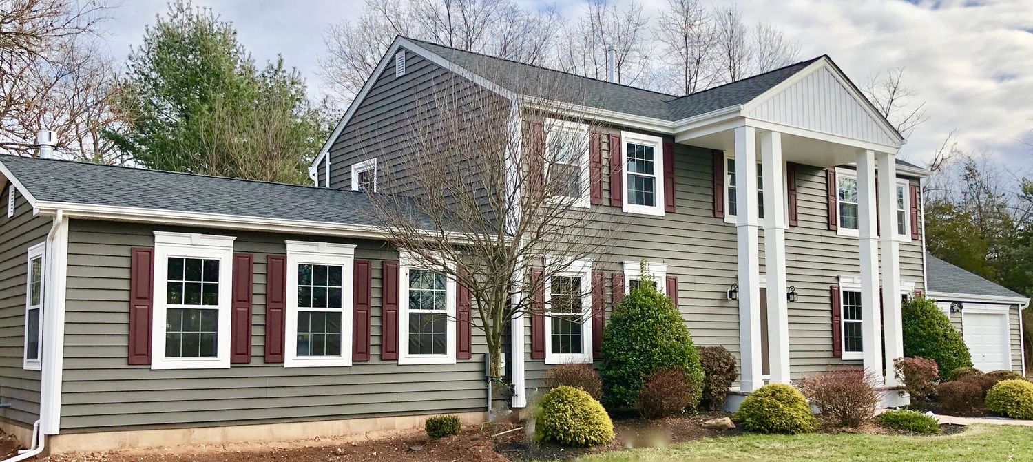 Home exterior with new siding, shutters and trim